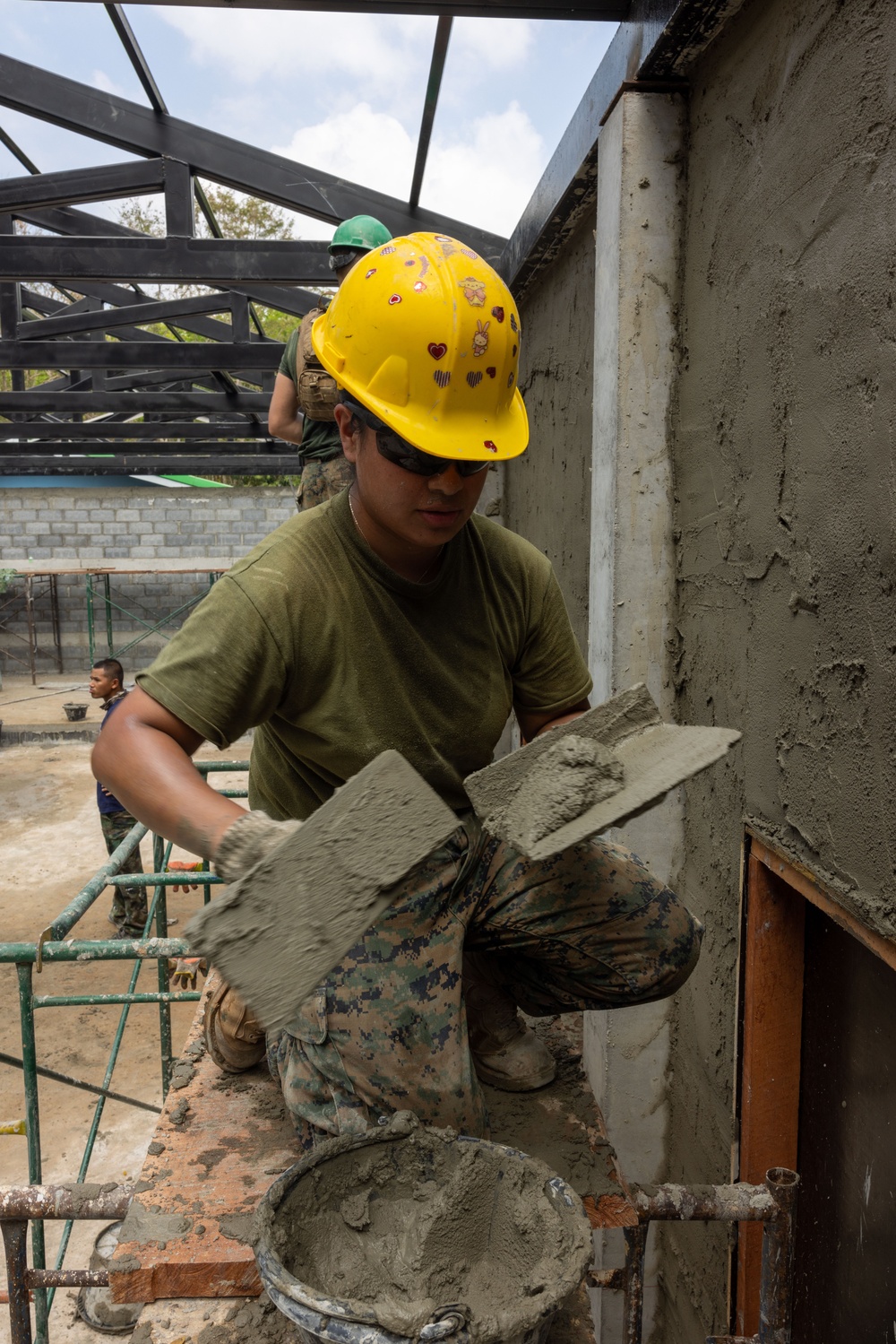 Cobra Gold 24; Marines with Marine Wing Support Squadron 171 apply stucco at the Ban Prakaet School