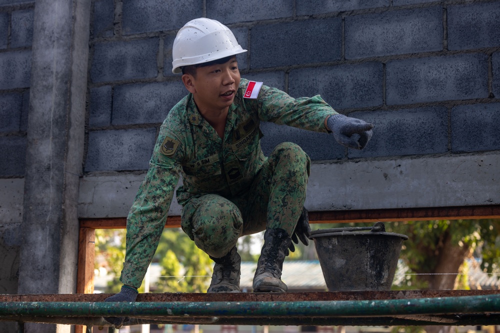 Cobra Gold 24; Marines with Marine Wing Support Squadron 171 apply stucco at the Ban Prakaet School