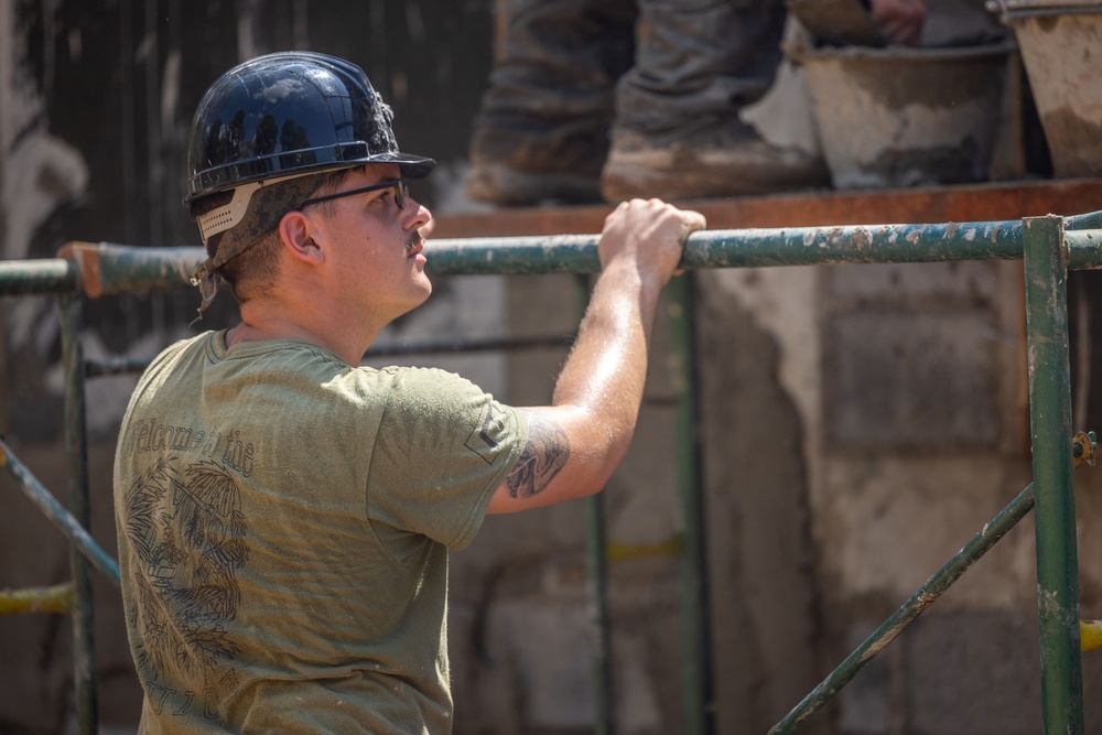 Cobra Gold 24; Marines with Marine Wing Support Squadron 171 apply stucco at the Ban Prakaet School