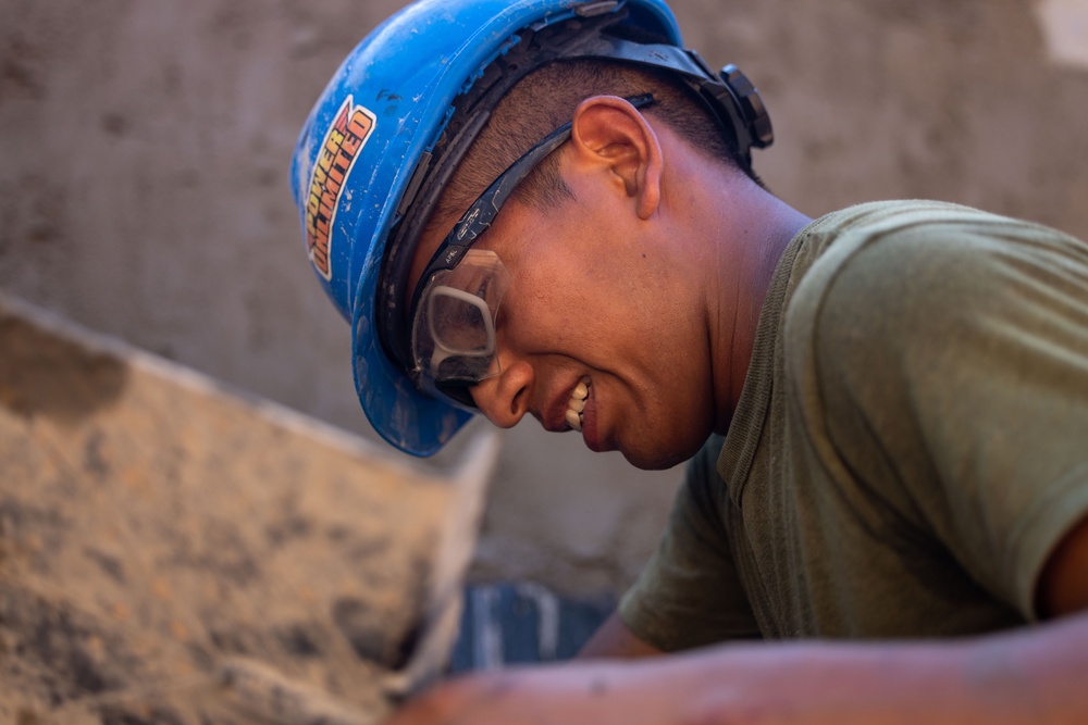 Cobra Gold 24; Marines with Marine Wing Support Squadron 171 apply stucco at the Ban Prakaet School