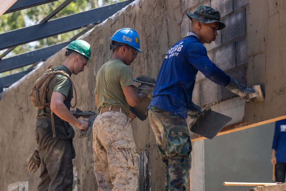 Cobra Gold 24; Marines with Marine Wing Support Squadron 171 apply stucco at the Ban Prakaet School