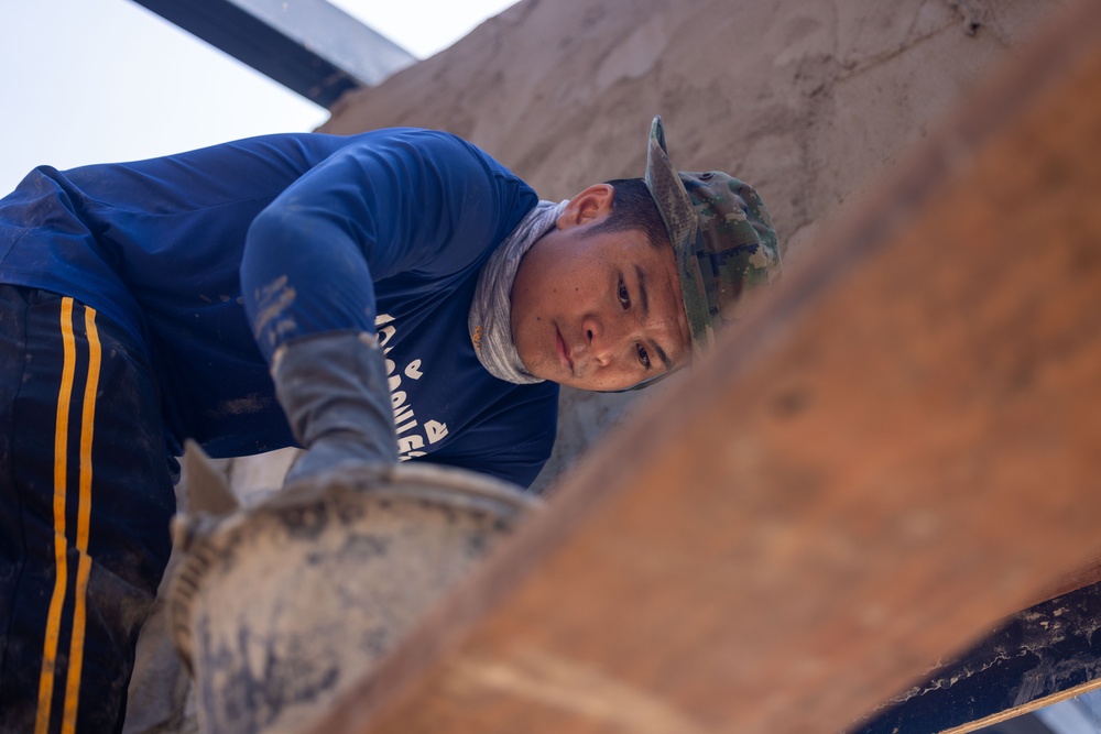 Cobra Gold 24; Marines with Marine Wing Support Squadron 171 apply stucco at the Ban Prakaet School