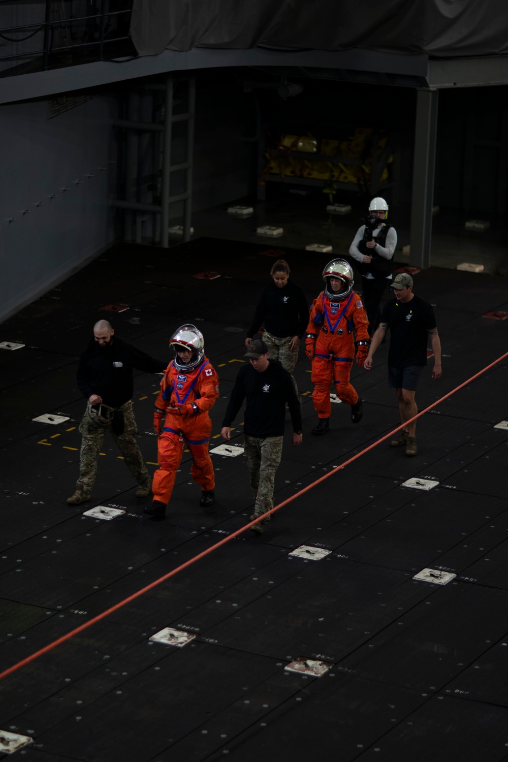 Astronauts run drills in a crew module test article aboard USS San Diego while underway for NASA’s Underway Recovery Test 11