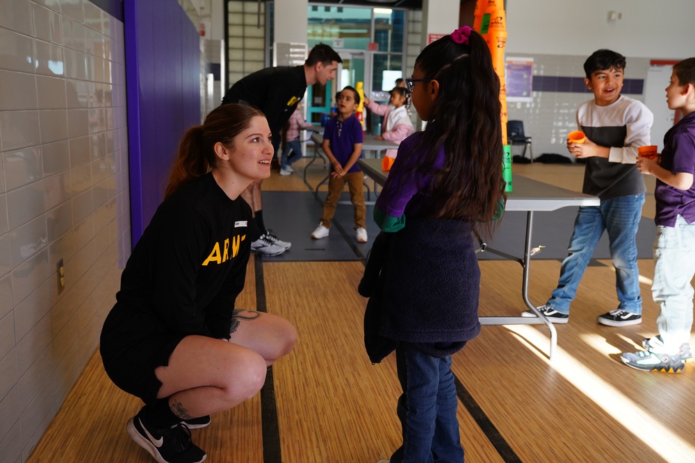 Fort Bliss Artillery Soldiers Bring Joy: A Day of Community Engagement at Sgt. Roberto Iduarte Elementary