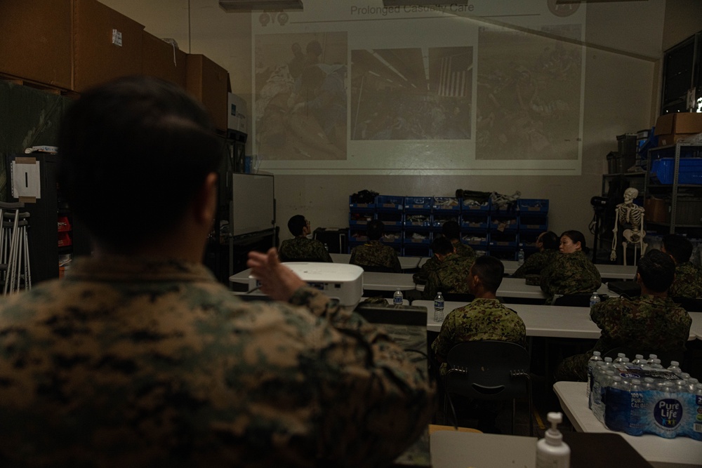 U.S. Navy Corpsman with 3rd Medical Battalion demonstrate a blood transfusion for the Japanese Ground Self Defense Force