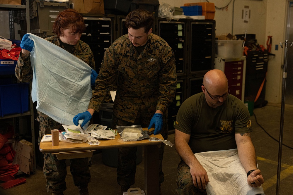 U.S. Navy Corpsman with 3rd Medical Battalion demonstrate a blood transfusion for the Japanese Ground Self Defense Force