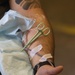 U.S. Navy Corpsman with 3rd Medical Battalion demonstrate a blood transfusion for the Japanese Ground Self Defense Force