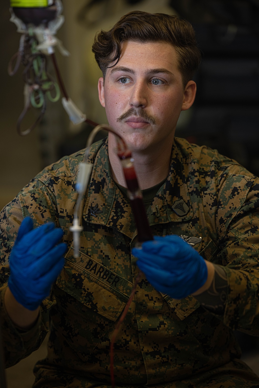 U.S. Navy Corpsman with 3rd Medical Battalion demonstrate a blood transfusion for the Japanese Ground Self Defense Force