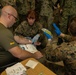 U.S. Navy Corpsman with 3rd Medical Battalion demonstrate a blood transfusion for the Japanese Ground Self Defense Force