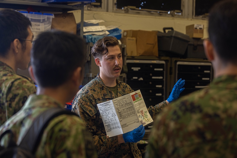 U.S. Navy Corpsman with 3rd Medical Battalion demonstrate a blood transfusion for the Japanese Ground Self Defense Force