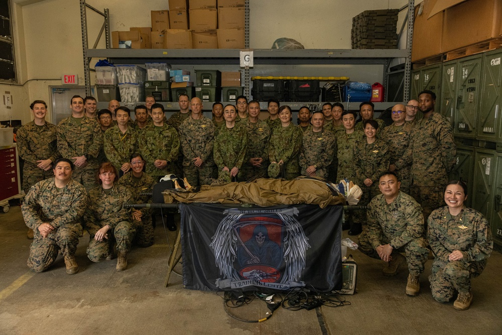 U.S. Navy Corpsman with 3rd Medical Battalion demonstrate a blood transfusion for the Japanese Ground Self Defense Force