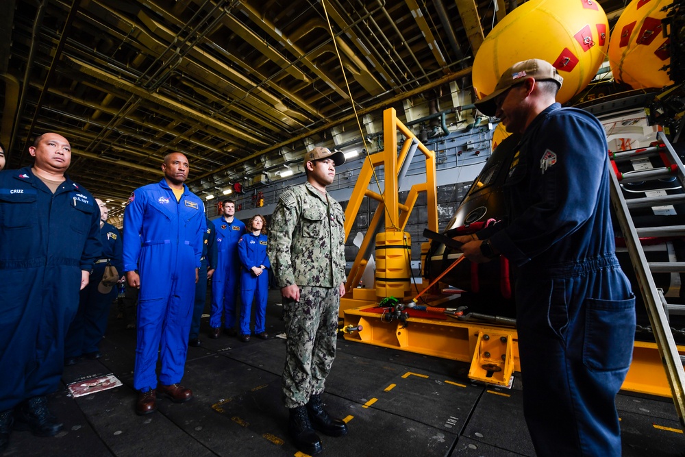 USS San Diego Sailor reenlisted by NASA astronaut during URT-11