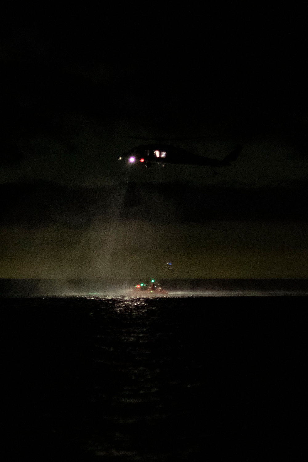 USS San Diego and Helicopter Sea Combat Squadron 23 conduct air rescue operations for NASA’s Underway Recovery Test 11
