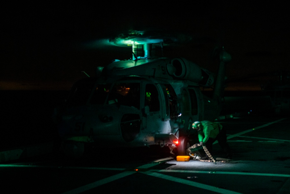 USS San Diego conducts nighttime recovery operations with Helicopter Sea Combat Squadron 23 during Underway Recovery Test 11