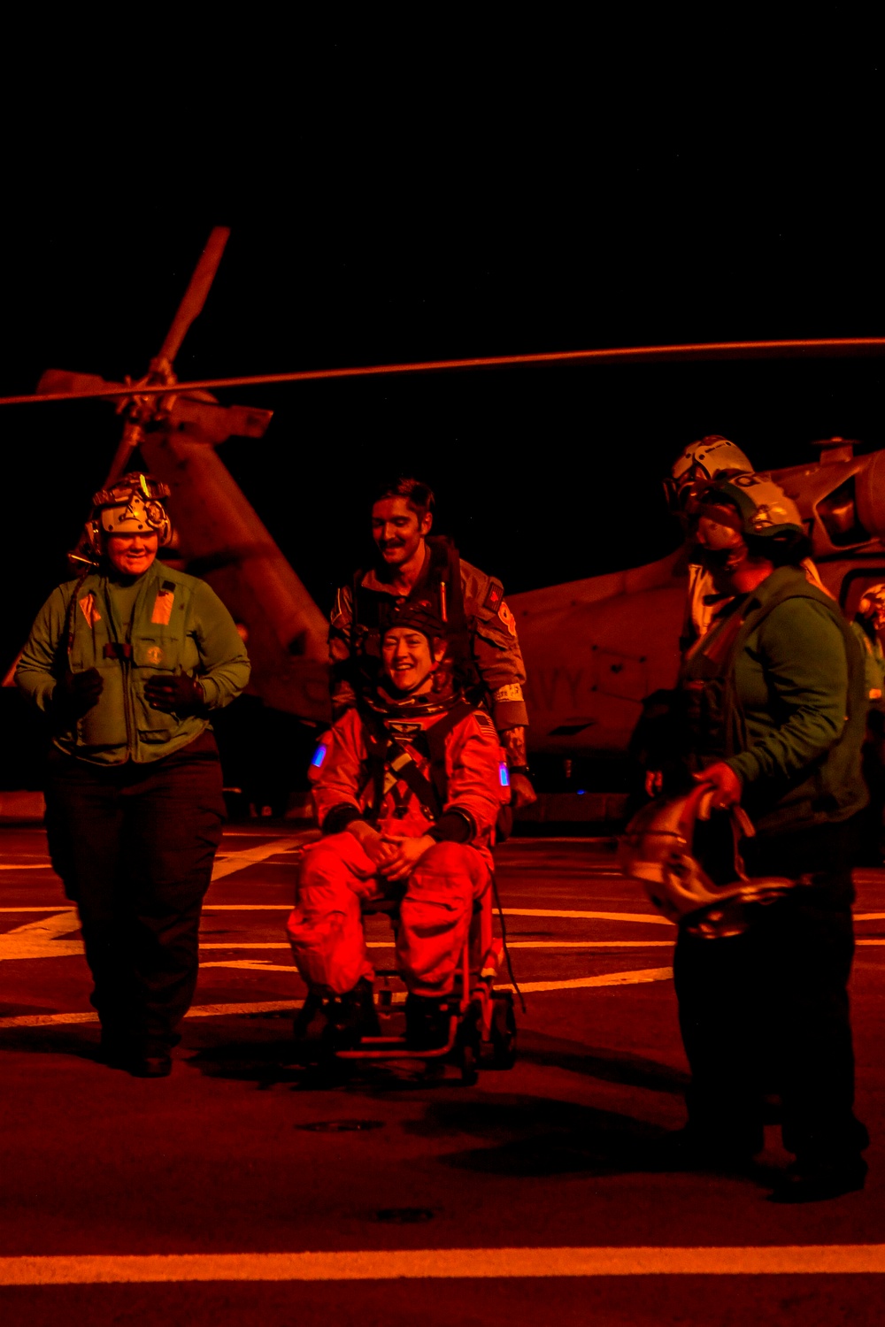 USS San Diego Sailors aid Artemis II crew members during Underway Recovery Test 11