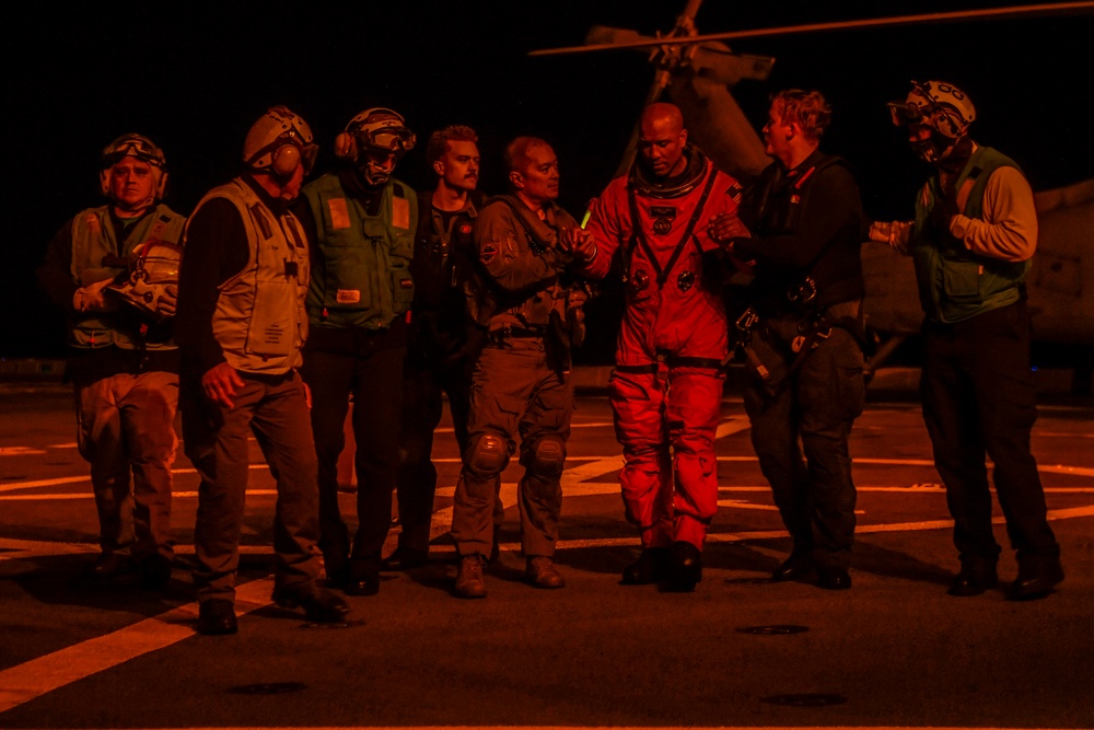 USS San Diego Sailors aid Artemis II crew members during Underway Recovery Test 11