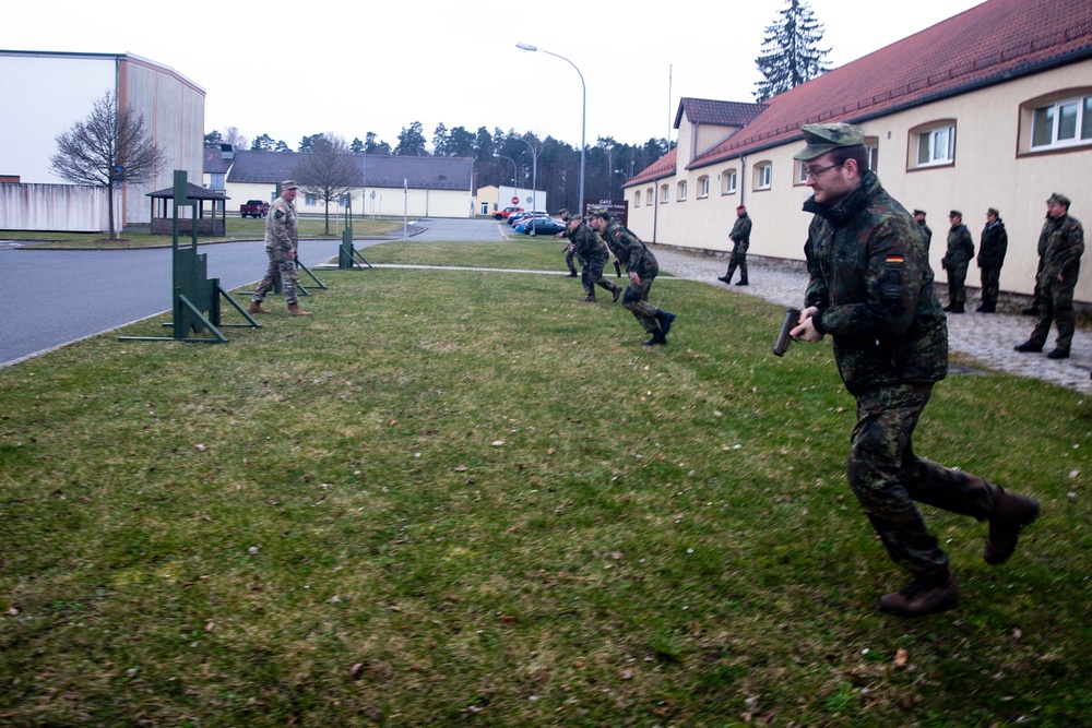 Bundeswehr Medical Academy soldiers practice basic operations of U.S. Army weapons