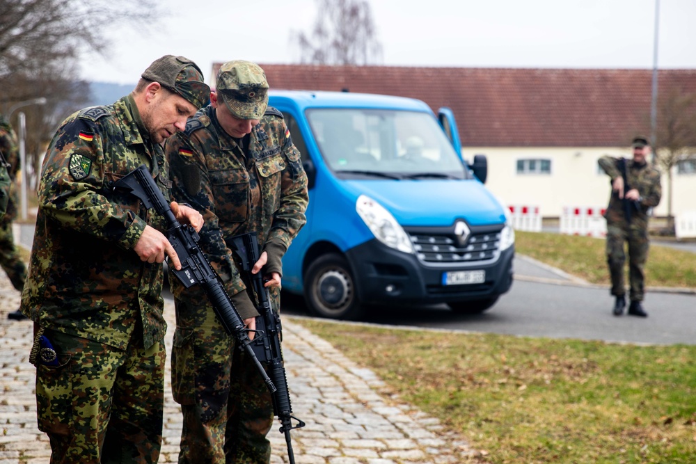 Bundeswehr Medical Academy soldiers practice basic operations of U.S. Army weapons