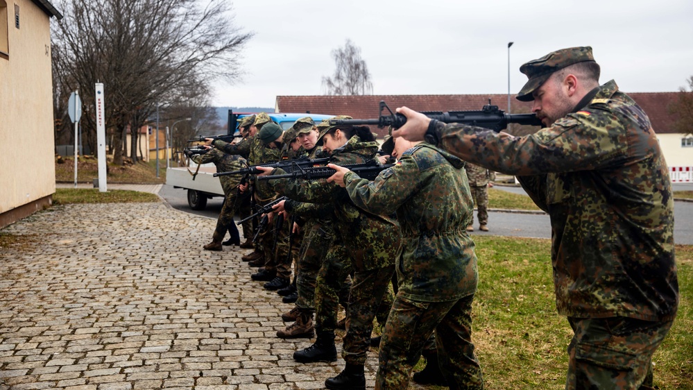 Bundeswehr Medical Academy soldiers practice basic operations of U.S. Army weapons