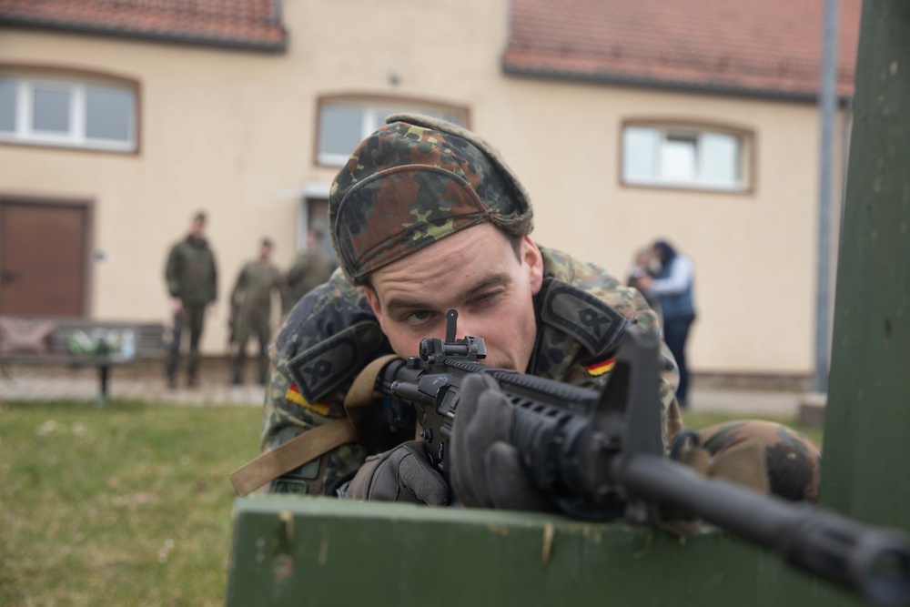 Bundeswehr Medical Academy soldiers practice basic operations of U.S. Army weapons