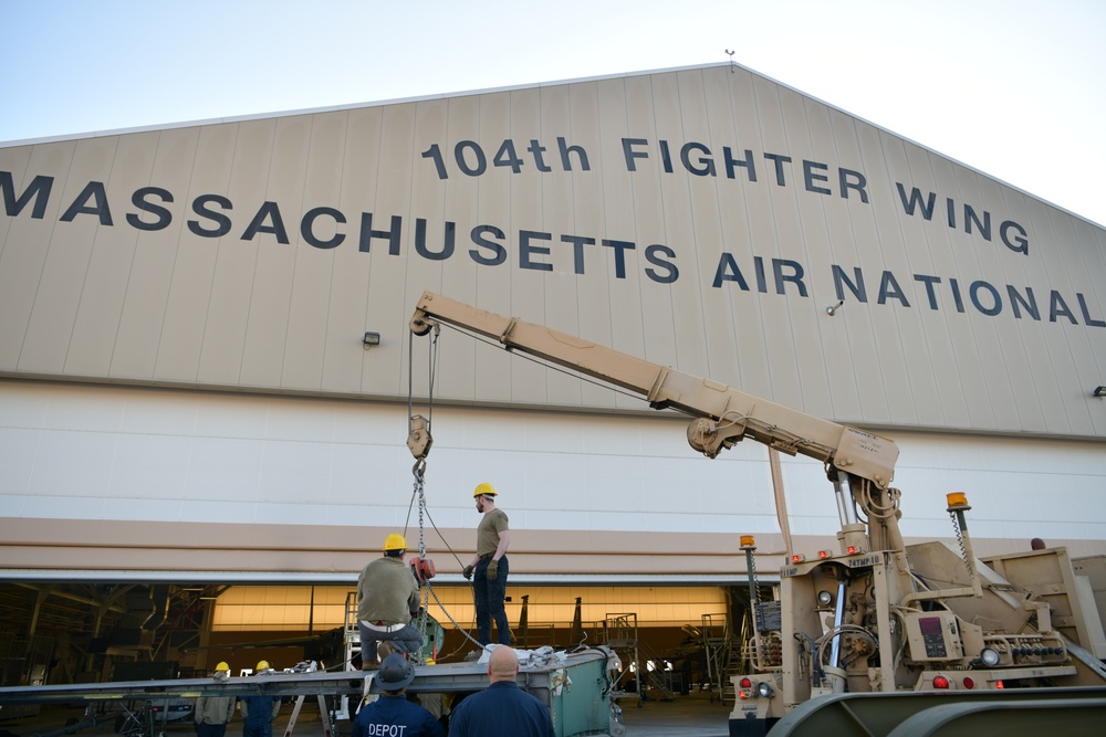 Depot team removes F-15 wing as 104FW prepares for conversion
