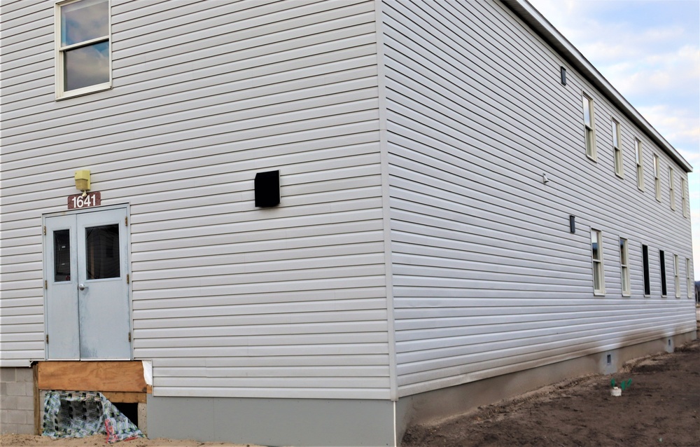 Reset of World War II-era barracks moved in 2023 continues; work nearly complete