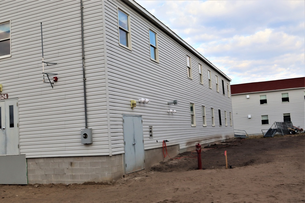 Reset of World War II-era barracks moved in 2023 continues; work nearly complete