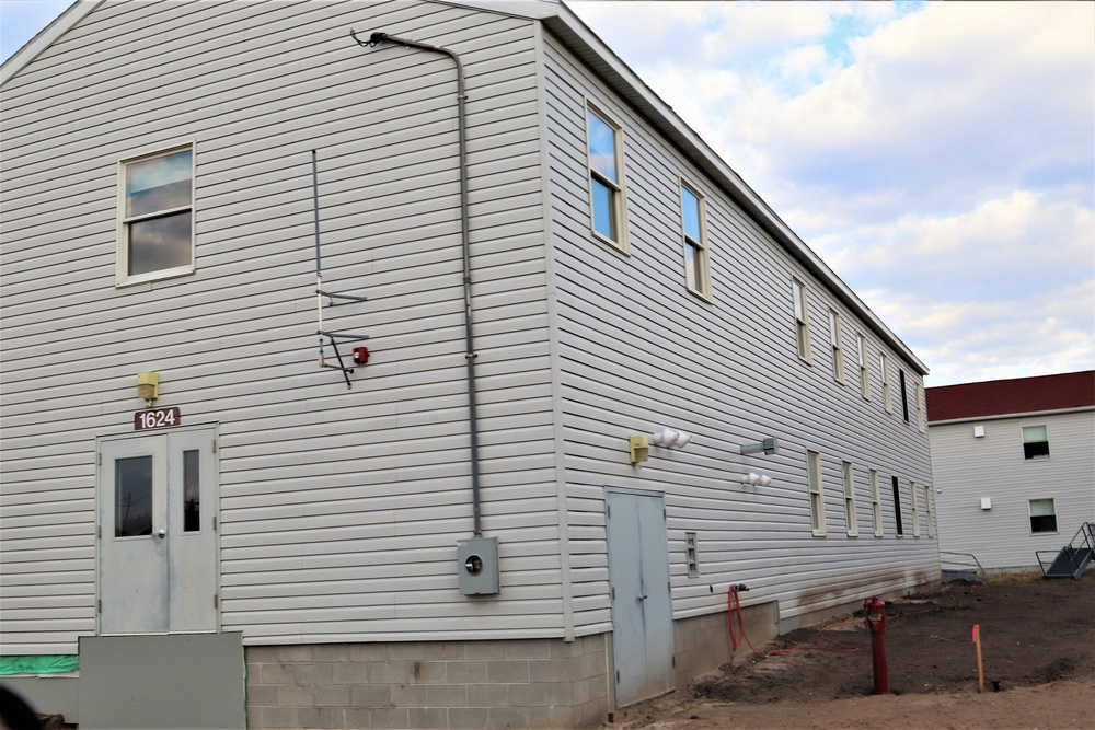 Reset of World War II-era barracks moved in 2023 continues; work nearly complete