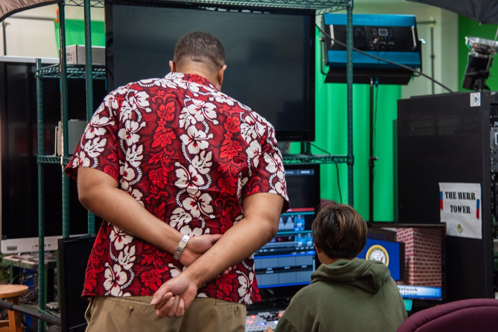 Honorable Franklin R. Parker, assistant Secretary of the Navy for Manpower and Reserve Affairs, toured Guam High school while visiting Guam