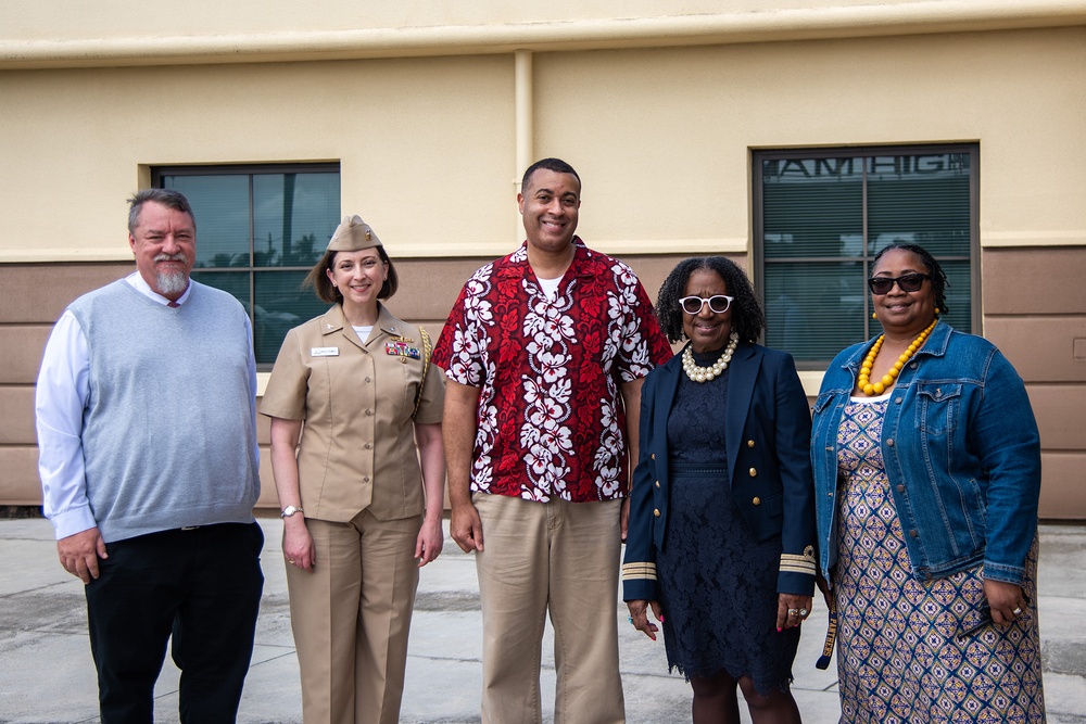 Honorable Franklin R. Parker, assistant Secretary of the Navy for Manpower and Reserve Affairs, toured Guam High school while visiting Guam