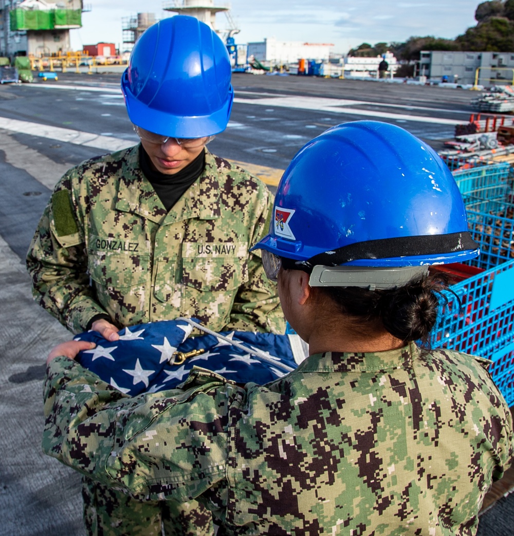 USS Ronald Reagan (CVN 76) Sailors conduct morning colors