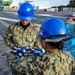 USS Ronald Reagan (CVN 76) Sailors conduct morning colors