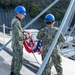 USS Ronald Reagan (CVN 76) Sailors conduct morning colors