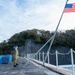 USS Ronald Reagan (CVN 76) Sailors conduct morning colors