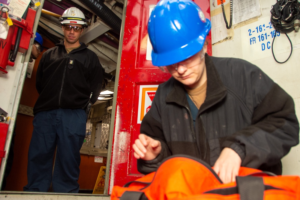 USS Ronald Reagan (CVN 76) Sailors conduct a repair locker inspection