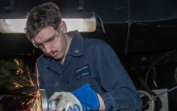 Headline: USS Ronald Reagan (CVN 76) Sailor metalsmiths for a repair