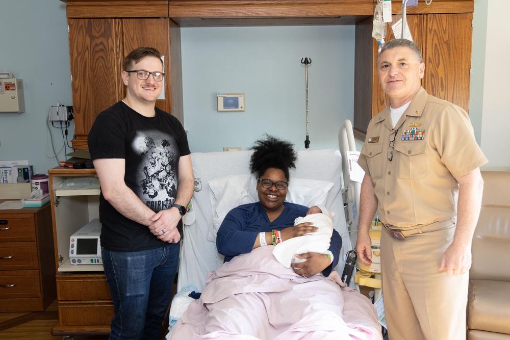 Capt. David G. Lang Presents Gift from Walter Reed to Leap Babies