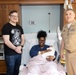 Capt. David G. Lang Presents Gift from Walter Reed to Leap Babies