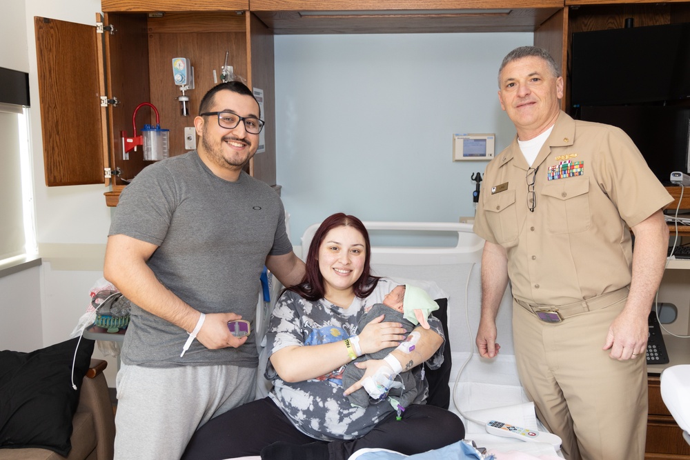 Capt. David G. Lang Presents Gift from Walter Reed to Leap Babies