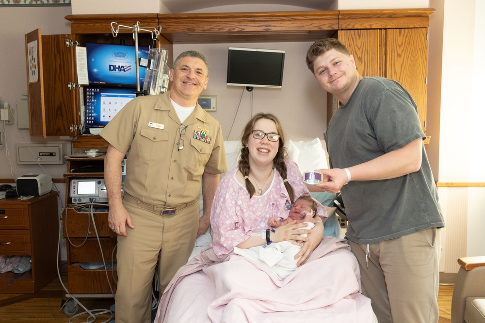 Capt. David G. Lang Presents Gift from Walter Reed to Leap Babies