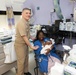 Capt. David G. Lang Presents Gift from Walter Reed to Leap Babies