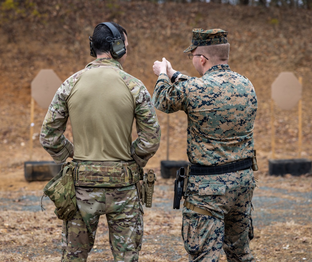 British Royal Marines conduct shooting drills with U.S. Marines during Operation Longshot