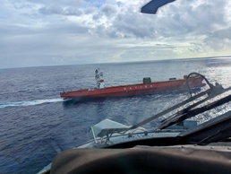 U.S. Coast Guard, Navy Helicopter Squadron execute critical medical evacuation of Filipino mariner northwest of Guam