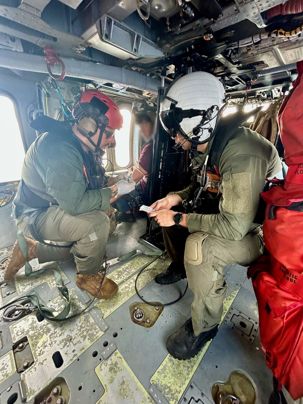 U.S. Coast Guard, Navy Helicopter Squadron execute critical medical evacuation of Filipino mariner northwest of Guam