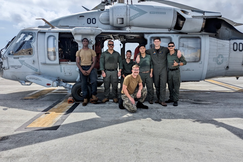 U.S. Coast Guard, Navy Helicopter Squadron execute critical medical evacuation of Filipino mariner northwest of Guam