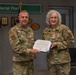 U.S. Maj. Kathy Koons receives a Certificate of Appreciation at her Retirement Ceremony