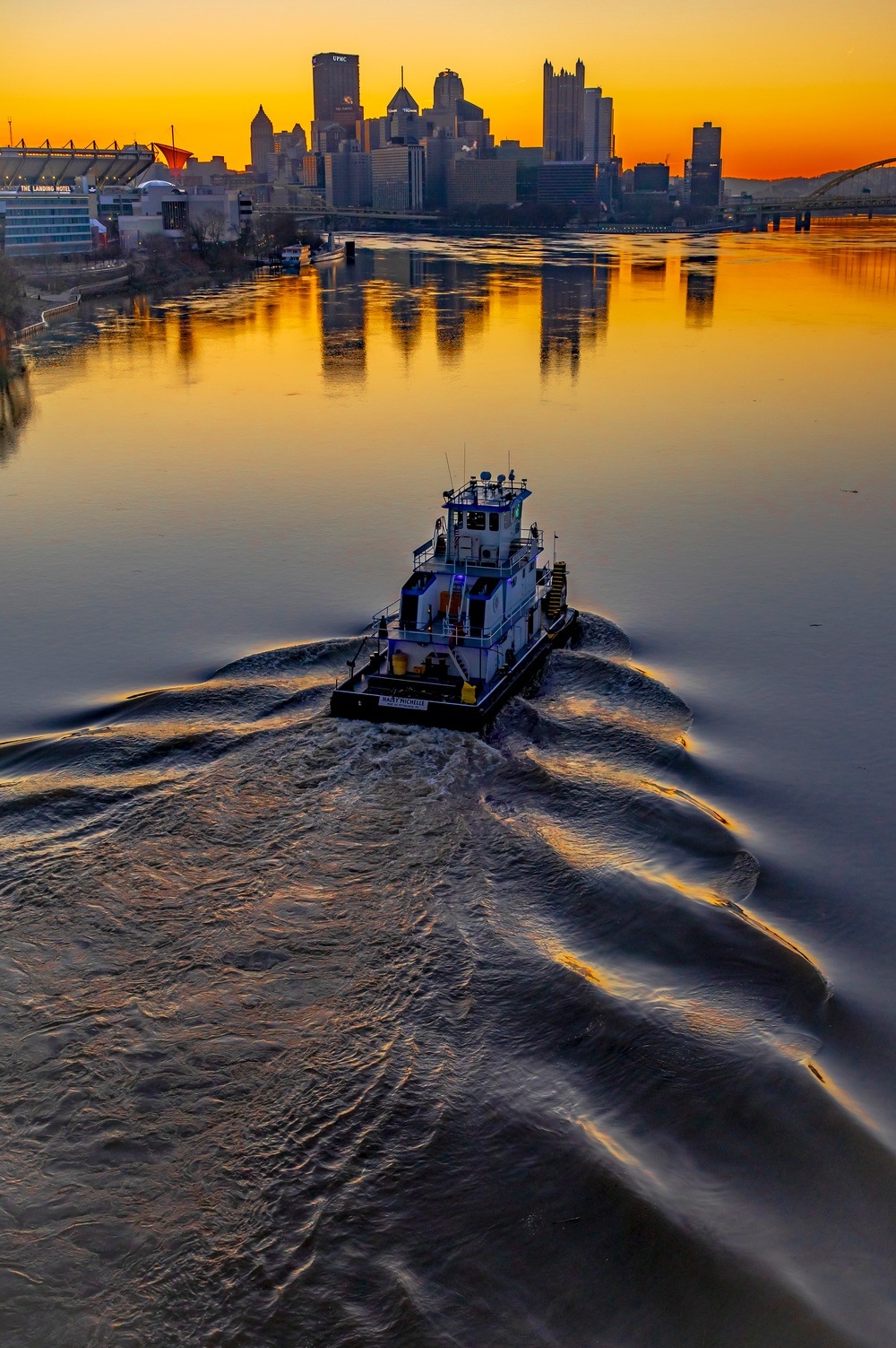 Barge traffic moves through port of Pittsburgh at sunrise