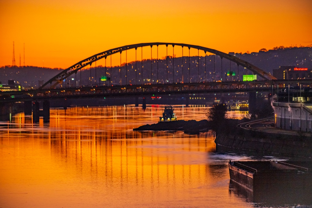 Barge traffic moves through port of Pittsburgh at sunrise