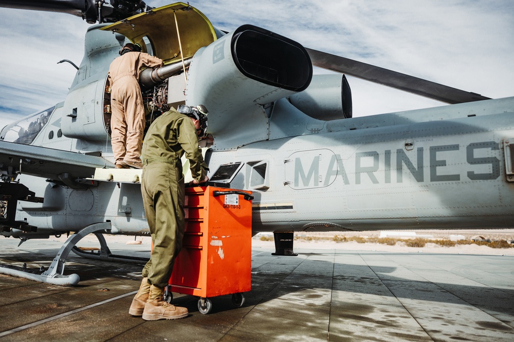 HMLA-267 Marines conduct maintenance on light attack helicopters during SLTE 2-24