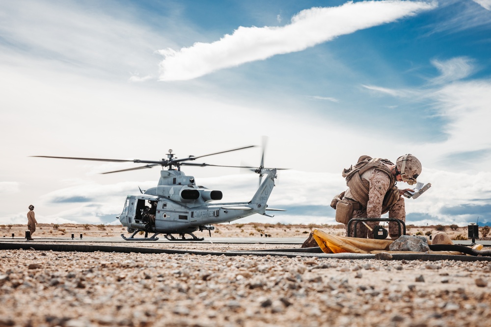 HMLA-267 Marines conduct maintenance on light attack helicopters during SLTE 2-24